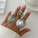Geometric ripple imitation pearl ring, irregular elliptical alloy winding ring