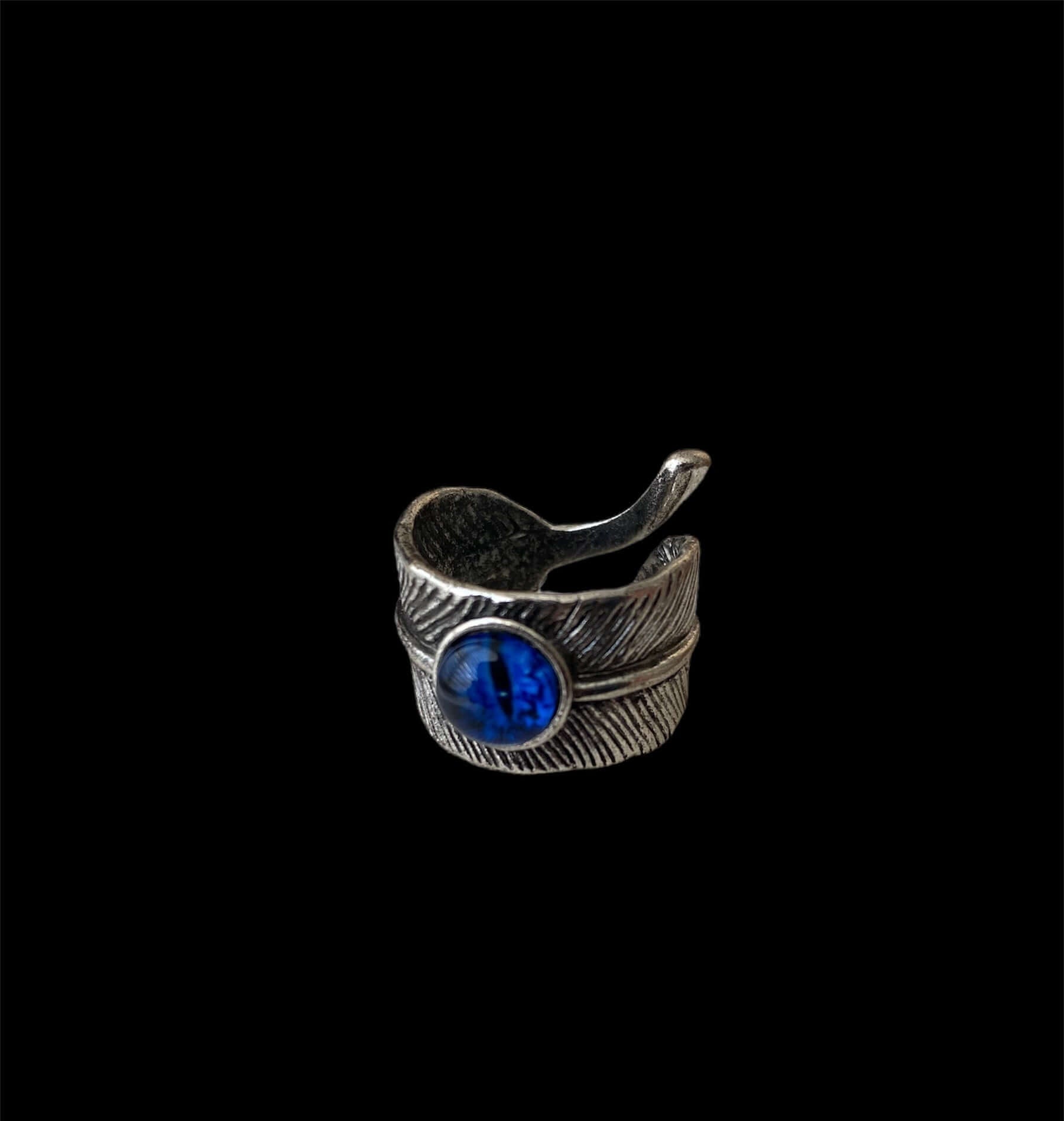 Anillo Acero Inoxidable Ajustable con diseño moderno y piedra azul decorativa.