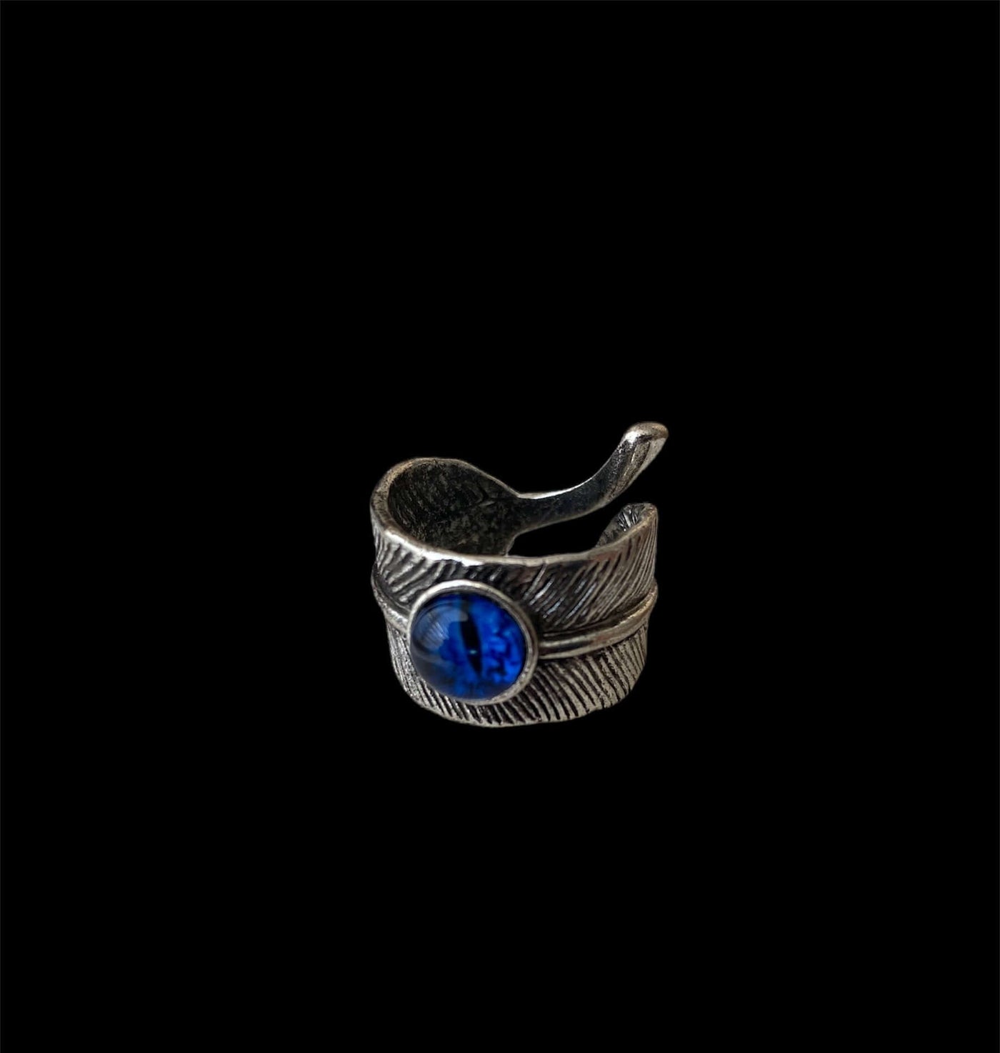 Anillo Acero Inoxidable Ajustable con diseño moderno y piedra azul decorativa.