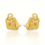 A little girl and a dog embrace earrings