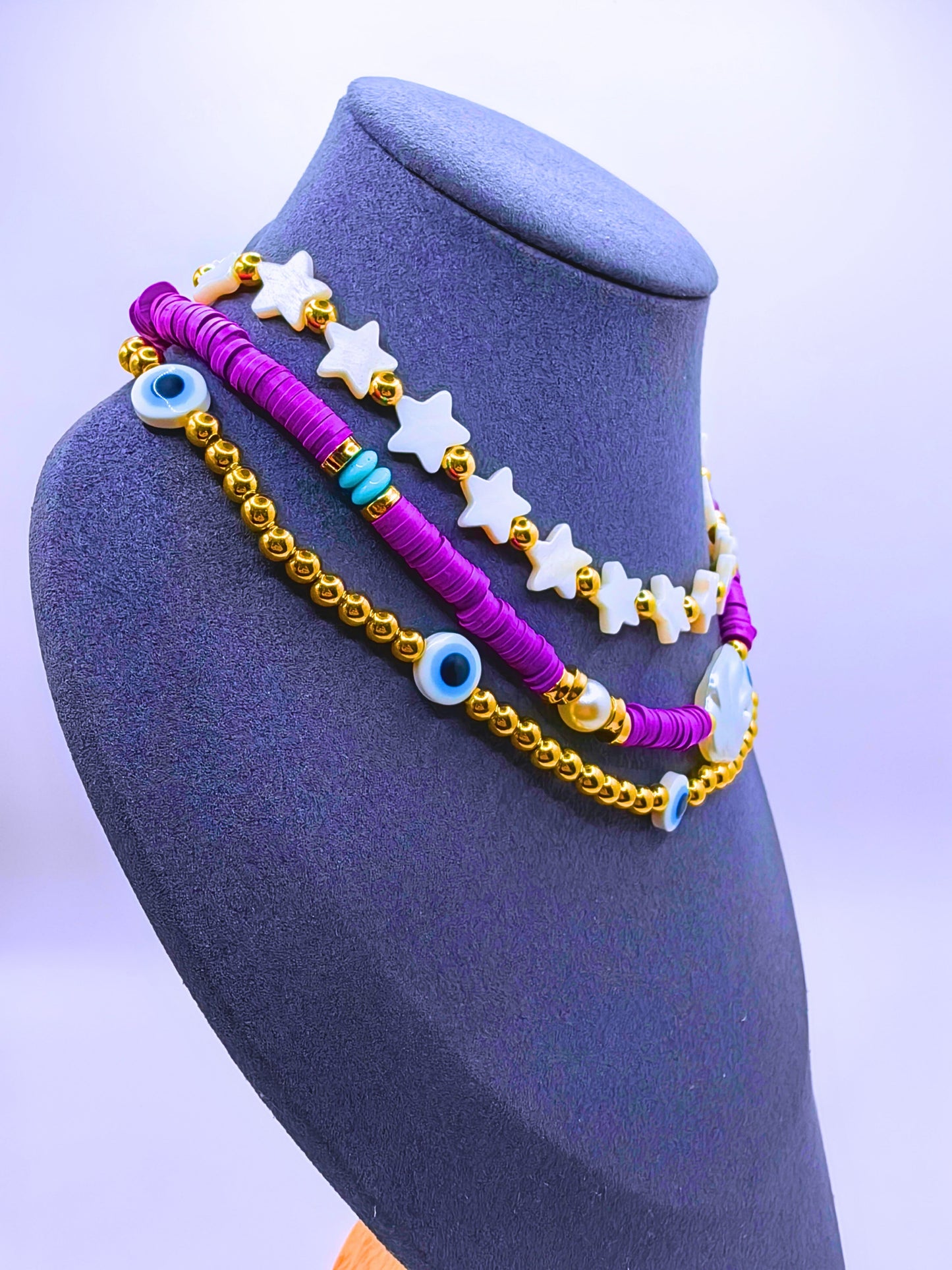 BNv0001 - Collar Plástico Bohemio Triple Morado Ojo Turco Calenbi
