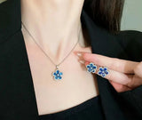 NEB0022 - Collar y Aretes Acero Inoxidable Circonita Cubica Flor Azul Calenbi Calenbi Joyería