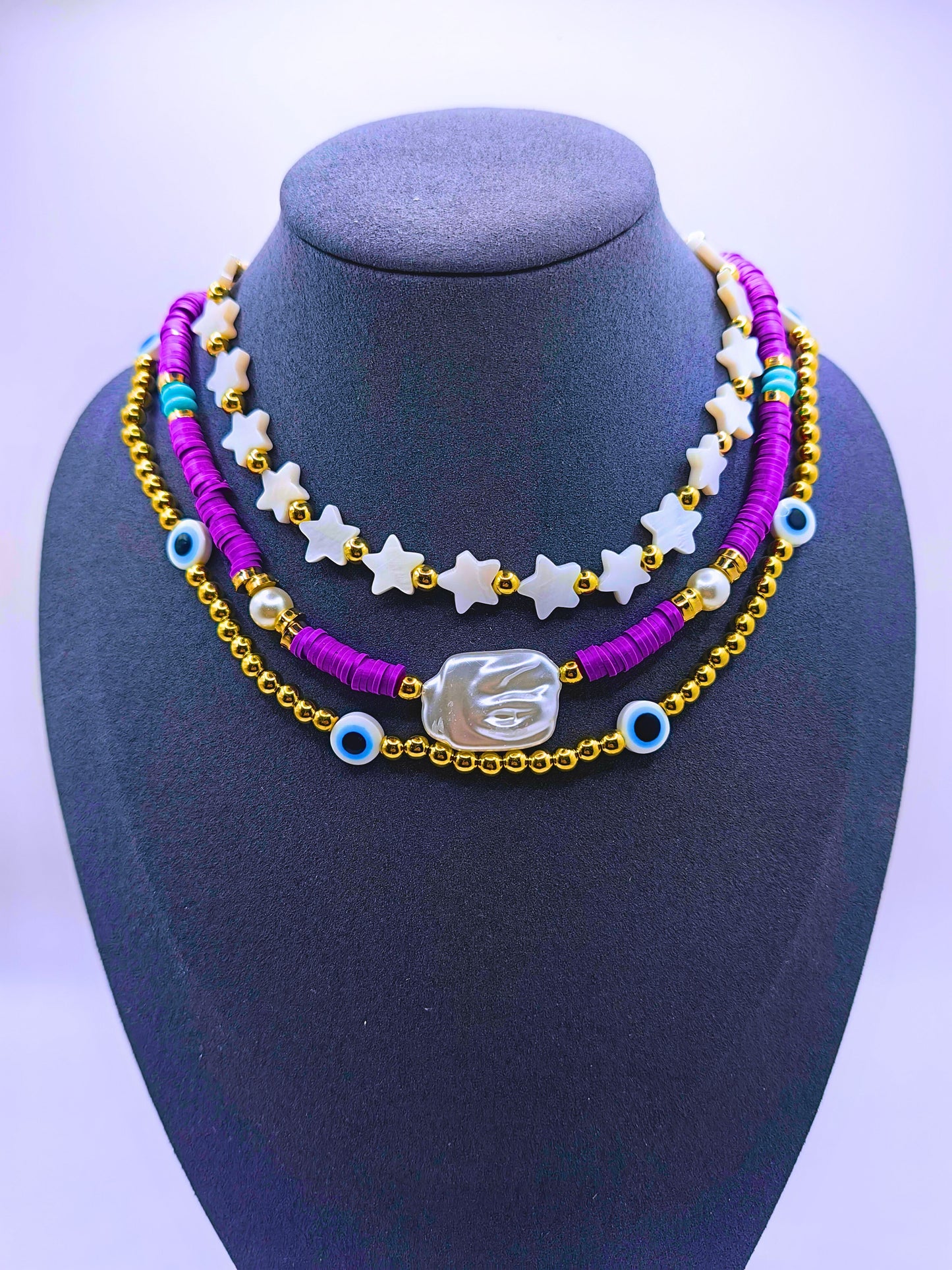 BNv0001 - Collar Plástico Bohemio Triple Morado Ojo Turco Calenbi