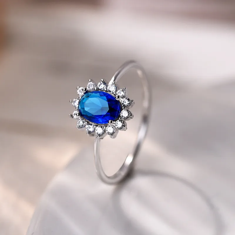 SR0070 Anillo S925 Ley "Oval" Circonita Cubica Azul y Blanco Cerrado Calenbi