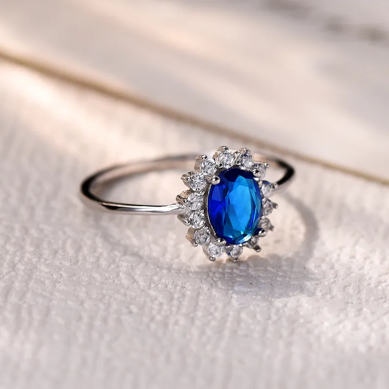 SR0070 Anillo S925 Ley "Oval" Circonita Cubica Azul y Blanco Cerrado Calenbi