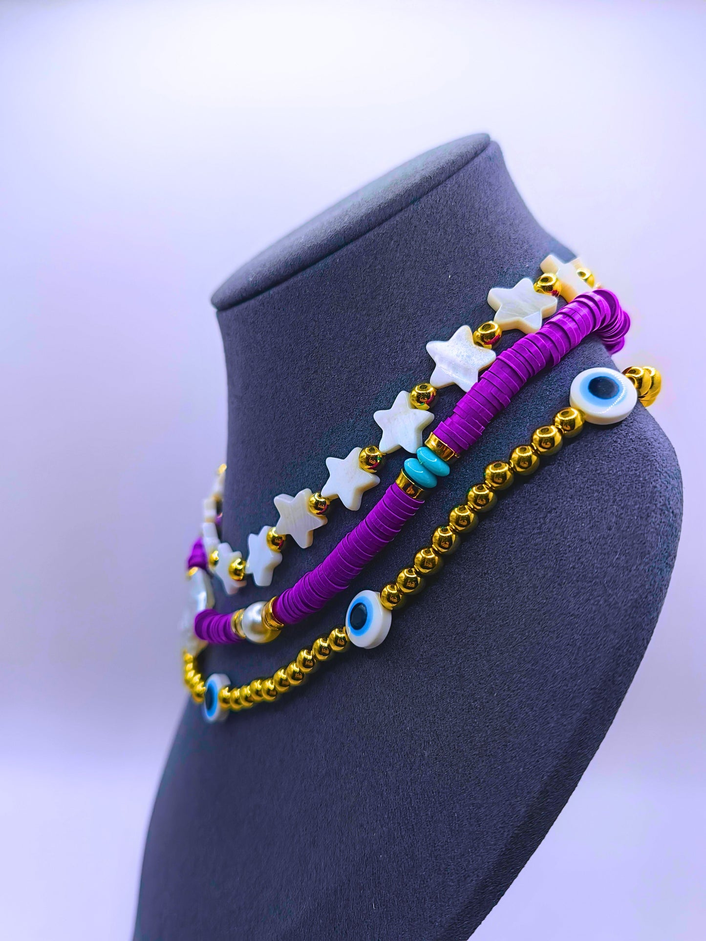 BNv0001 - Collar Plástico Bohemio Triple Morado Ojo Turco Calenbi